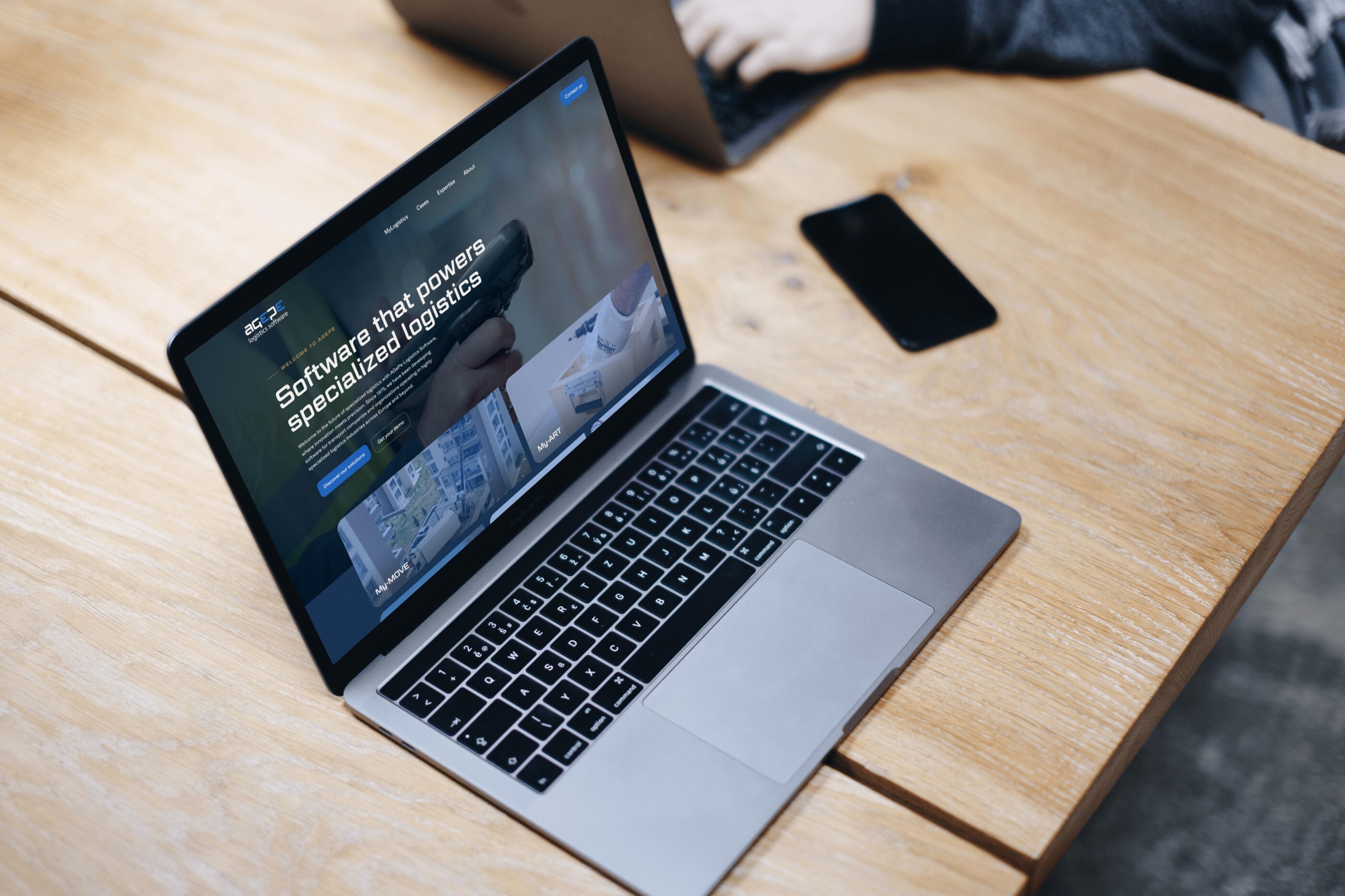 Mockuuups Free Macbook Pro Space Gray mockup on the wooden table